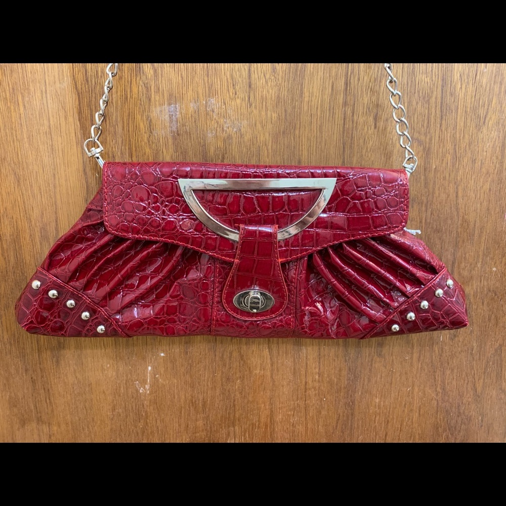 Burgundy snakeskin style purse with silver chain